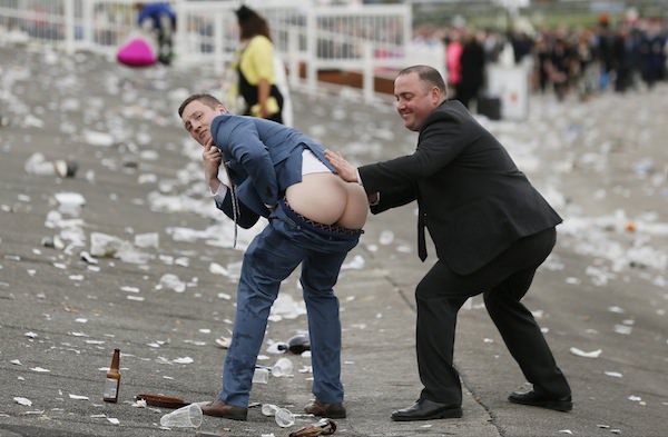 Horse Racing - Crabbie's Grand National Festival - Aintree Racecourse - 8/4/16 Racegoers have fun as they leave after Ladies Day Action Images via Reuters / Jason Cairnduff Livepic EDITORIAL USE ONLY.
